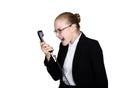 Little business woman talking on a phone, screaming into the phone. Studio portrait of child girl in business style Royalty Free Stock Photo