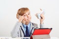 Little businessman talking by smartphone. Boy holding money. Future education, proffesion Royalty Free Stock Photo