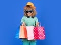 Little buyer customer. Child on shopping. Portrait of child boy with shopping bags. Fashion child in shirt, sunglasses