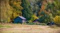 Little cabin in autumn forest