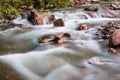 Little cascade falls of water over mountain river rocks Royalty Free Stock Photo