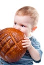 A little Caucasian boy eating a bread. Royalty Free Stock Photo