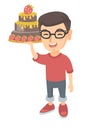 Little caucasian boy holding a chocolate cake. Royalty Free Stock Photo