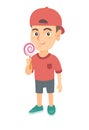 Little caucasian boy holding a lollipop candy. Royalty Free Stock Photo