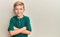 Little caucasian boy kid wearing casual clothes happy face smiling with crossed arms looking at the camera Royalty Free Stock Photo