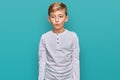 Little caucasian boy kid wearing casual clothes making fish face with lips, crazy and comical gesture Royalty Free Stock Photo