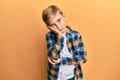 Little caucasian boy kid wearing casual clothes thinking looking tired and bored with depression problems with crossed arms Royalty Free Stock Photo