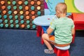 Little caucasian boy playing educational games one Royalty Free Stock Photo