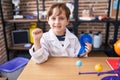 Little caucasian boy at school scientist laboratory winning first prize screaming proud, celebrating victory and success very