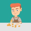 Caucasian boy counting coins on the table. Royalty Free Stock Photo