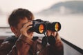 Little boy watching, looking, gazing, searching for by binocular Royalty Free Stock Photo