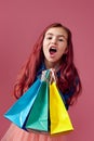 little caucasian child girl holds shopping bags Royalty Free Stock Photo