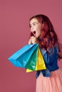 little caucasian child girl holds shopping bags Royalty Free Stock Photo