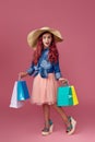 little caucasian child girl holds shopping bags Royalty Free Stock Photo