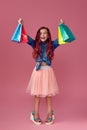 little caucasian child girl holds shopping bags Royalty Free Stock Photo
