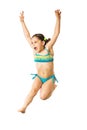 Little caucasian female 8 years old girl in multicoloured swimmwear jumping on white background. Royalty Free Stock Photo