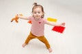 Little Caucasian girl dancing with toys at home feeling joy and happy Royalty Free Stock Photo