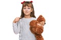 Little caucasian girl kid hugging teddy bear stuffed animal pointing finger to one self smiling happy and proud Royalty Free Stock Photo