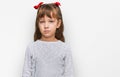 Little caucasian girl kid wearing casual clothes skeptic and nervous, frowning upset because of problem Royalty Free Stock Photo