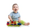 Little cheerful baby with block toys