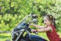 Little cheerful girl on old bike