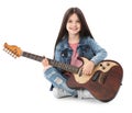 Little cheerful girl playing guitar, isolated
