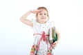 A little cheerful girl with textbooks. Royalty Free Stock Photo