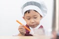 A little chef is eating yogurt Royalty Free Stock Photo