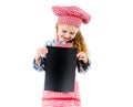 Little chef girl holding piece of paper with free space, isolated Royalty Free Stock Photo