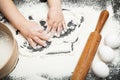 Little chef plays with small hands with flour