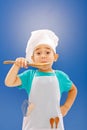 Little chef tasting food Royalty Free Stock Photo