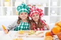 Little chefs slicing fruits in the kitchen Royalty Free Stock Photo