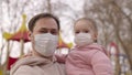 little child in arms of his father protective medical mask, happy childhood, pandemic coronavirus infection covid-19