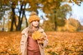 Little Child Baby Girl Caucasian Walking in Park with Leaf Autumn Golden Fall