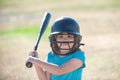 Little child baseball player focused ready to bat. Kid holding a baseball bat. Royalty Free Stock Photo