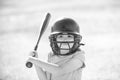 Little child baseball player focused ready to bat. Kid holding a baseball bat. Royalty Free Stock Photo