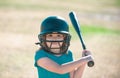 Little child baseball player focused ready to bat. Kid holding a baseball bat. Royalty Free Stock Photo