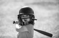 Little child baseball player focused ready to bat. Kid holding a baseball bat. Royalty Free Stock Photo