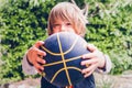 Little child basketball player outdoor sensory connections