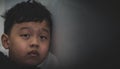 Little child boy Asia head to wall with sad upset fail bored facial expression concept with copy space Royalty Free Stock Photo