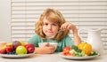 Little child boy having healthy breakfast. Kids nutrition and development. Eating vegetables by child make them Royalty Free Stock Photo