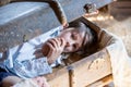 Little child, boy, hiding in old vintage suitcase in the attic