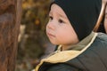 Little child boy playing in autumn park in Asia copy space. Toddler cute Korean kid portrait close-up outdoors Royalty Free Stock Photo