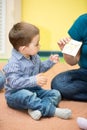 Little child boy playing in kindergarten in Montessori preschool Royalty Free Stock Photo