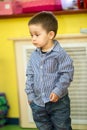 Little child boy playing in kindergarten in Montessori preschool Royalty Free Stock Photo