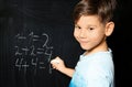 Little child with chalk doing math Royalty Free Stock Photo