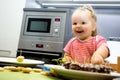 Little child chief cooking cookies in the kitchen Royalty Free Stock Photo