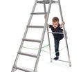 Little child climbing up ladder on background. Danger at home Royalty Free Stock Photo