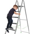 Little child climbing up ladder on background. Danger at home Royalty Free Stock Photo