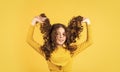 Little child curly hair. Fashion and beauty. Professional cosmetics. Freedom self expression. Girl hairdresser salon